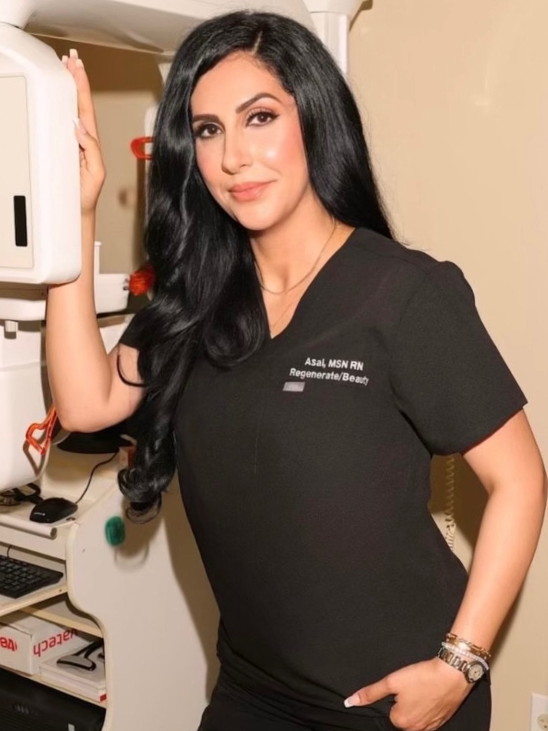 Medical professional posing in clinic setting.