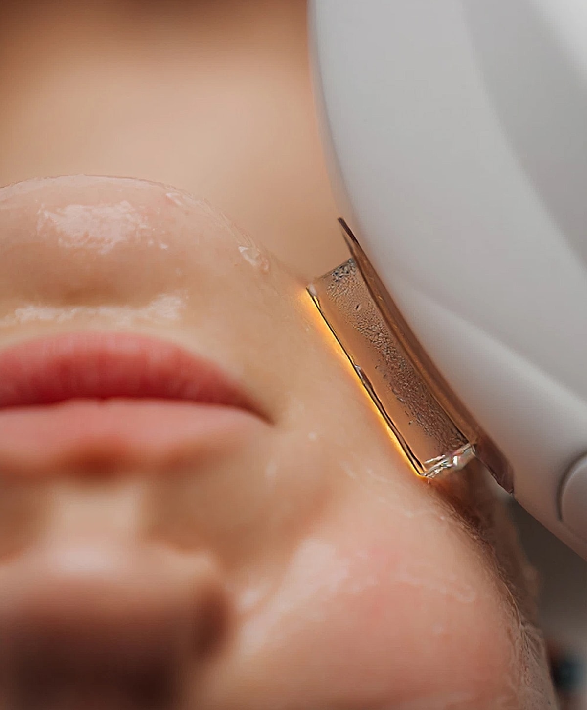 Smiling woman with long, wavy hair.