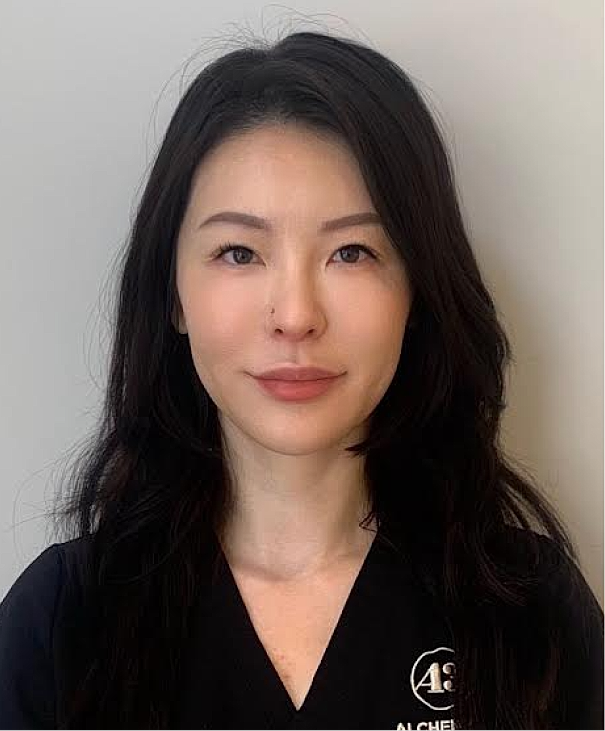 Portrait of a woman in professional attire.