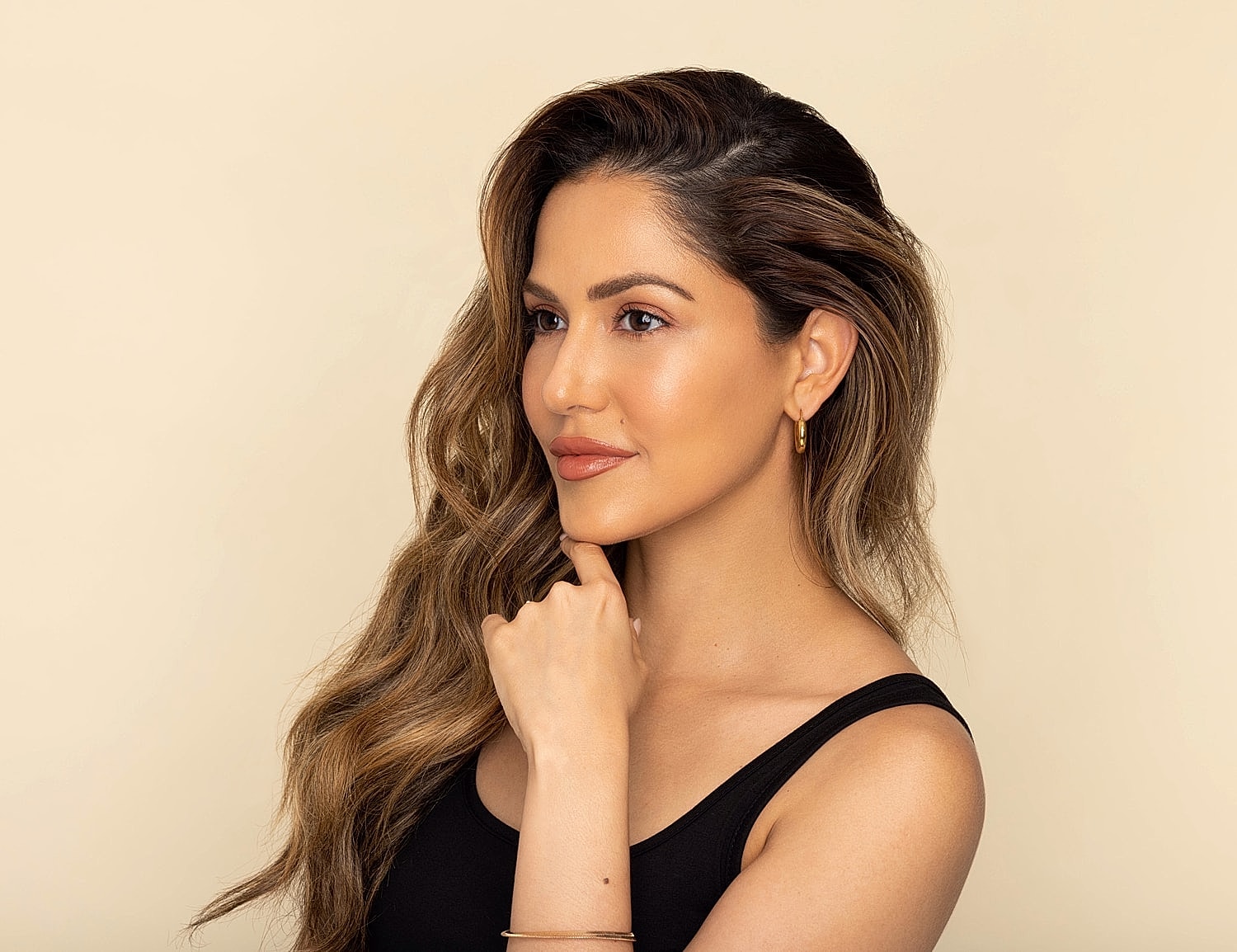 Profile of a woman with wavy hair.