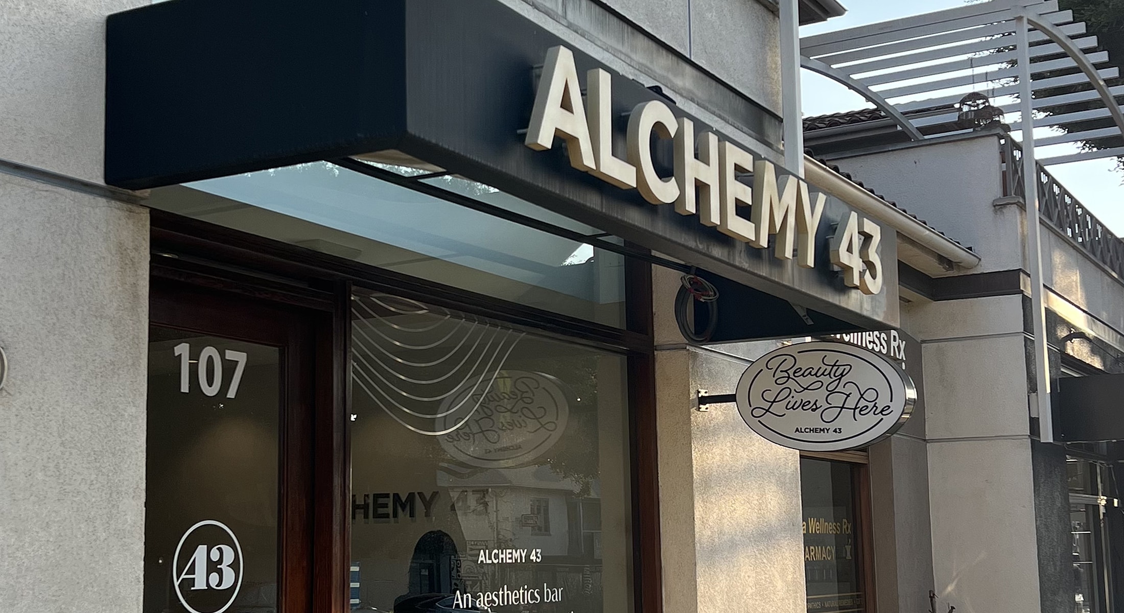 Signage of Alchemy 43 aesthetics bar.